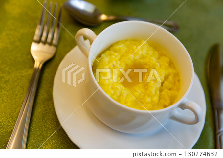Millet porridge in bowl at eatery, Russian cuisine Millet porridge in bowl at eatery, Russian cuisine 130274632