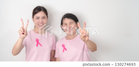 Couple woman with pink Ribbon for Pink October Breast Cancer Awareness month, May Women Health, November Birth Parents Adoption, women rights, Empowerment, March International Women day and Cancer day 130274693