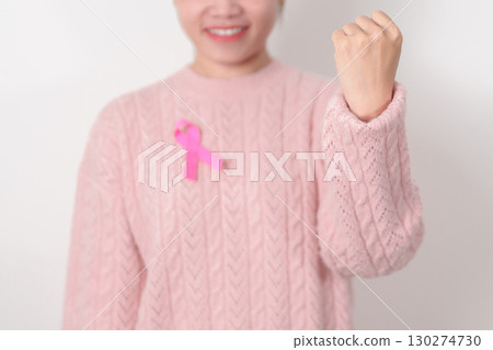 Pink October Breast Cancer Awareness month, woman with pink Ribbon for concepts of support people life and illness. National cancer survivors month, Women Health day and February World cancer day 130274730