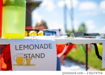 Lemonade stand offers refreshing drinks at local community event under sunny skies Lemonade stand offers refreshing drinks at local community event under sunny skies 130274758