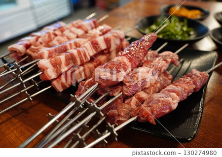 Grilled Lamb Skewers on a BBQ Grill Grilled Lamb Skewers on a BBQ Grill 130274980