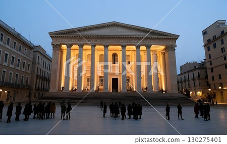 Classical building at dusk people gathered in city square 130275401