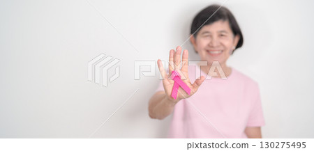 Elderly woman with pink Ribbon for Pink October Breast Cancer Awareness month, May Women Health, August World Breastfeeding week, Nursing Mothers, Pregnancy and Infant Loss Remembrance, Stillbirth Elderly woman with pink Ribbon for Pink October Breast Cancer Awareness month, May Women Health, August World Breastfeeding week, Nursing Mothers, Pregnancy and Infant Loss Remembrance, Stillbirth 130275495