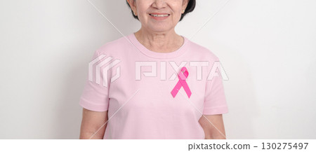 Elderly woman with pink Ribbon for Pink October Breast Cancer Awareness month, May Women Health, August World Breastfeeding week, Nursing Mothers, Pregnancy and Infant Loss Remembrance, Stillbirth Elderly woman with pink Ribbon for Pink October Breast Cancer Awareness month, May Women Health, August World Breastfeeding week, Nursing Mothers, Pregnancy and Infant Loss Remembrance, Stillbirth 130275497