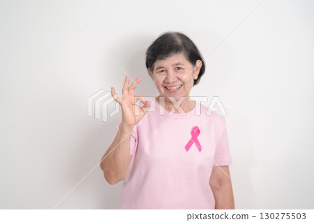 Elderly woman with pink Ribbon for Pink October Breast Cancer Awareness month, May Women Health, August World Breastfeeding week, Nursing Mothers, Pregnancy and Infant Loss Remembrance, Stillbirth Elderly woman with pink Ribbon for Pink October Breast Cancer Awareness month, May Women Health, August World Breastfeeding week, Nursing Mothers, Pregnancy and Infant Loss Remembrance, Stillbirth 130275503