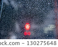 Red light through a plastic umbrella 130275648