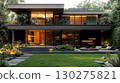 Modern two story house with a sleek design, illuminated exterior, and landscaped front yard 130275821