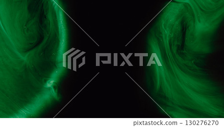 Color fog. Ink vapor. Wet dye wave flow on green light round curve gleam. Art drop explosion abstract shade blur black background. 130276270