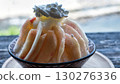 Shaved ice topped with lots of peaches 130276336
