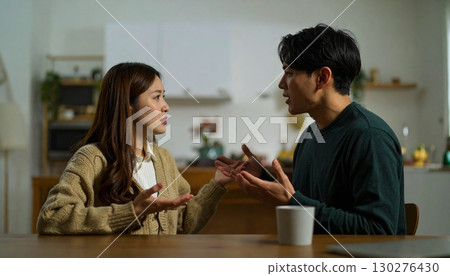 Couple arguing in the living room 130276430