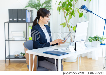 Business woman working in the office Business woman working in the office 130276590