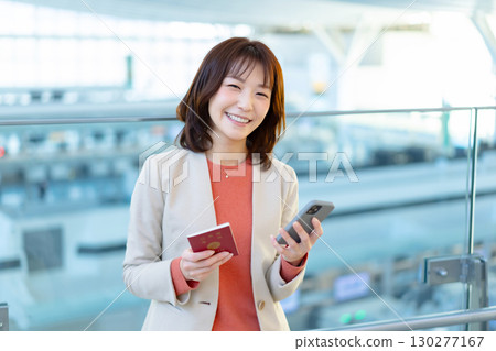 A woman with a passport 130277167