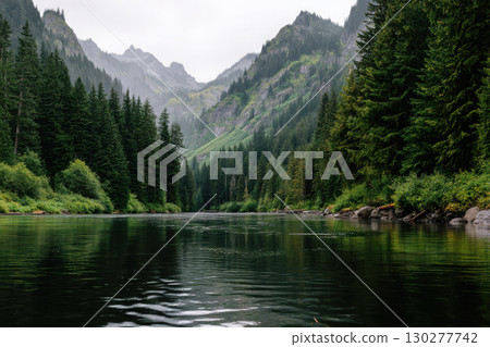Panoramic view of a tranquil lake surrounded by mountains Panoramic view of a tranquil lake surrounded by mountains 130277742