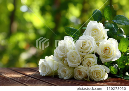 Beautiful white roses captured in soft afternoon light 130278030