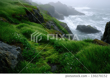 Lush green cliffs overlooking crashing ocean waves 130278152