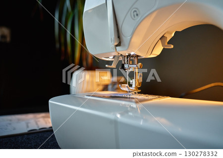Close-up of sewing machine needle and presser foot Close-up of sewing machine needle and presser foot 130278332