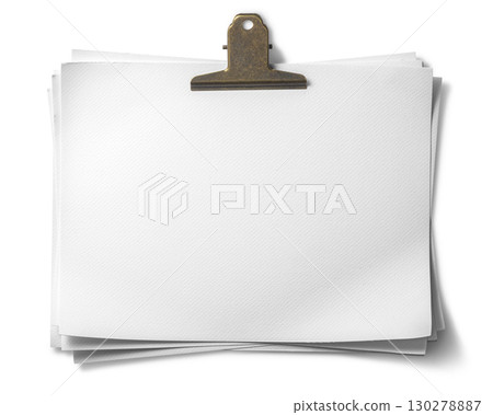 A piece of white paper held in place by a paperclip 130278887
