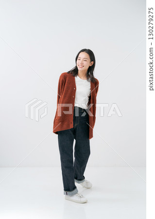 Woman wearing a knitted cardigan Woman wearing a knitted cardigan 130279275