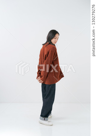Woman wearing a knitted cardigan Woman wearing a knitted cardigan 130279276