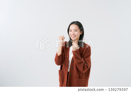 Woman wearing a knitted cardigan Woman wearing a knitted cardigan 130279397