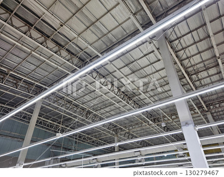 Industrial Warehouse or Commercial Space Ceiling with Modern LED Lighting. 130279467