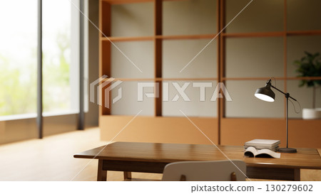 Minimalist workspace with wooden desk, desk lamp, stacked books, and open notebook in modern office 130279602