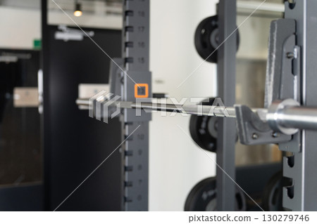 Sports gym interior (power rack, barbell) 130279746