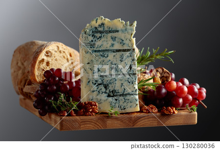 Gorgonzola cheese with ciabatta, walnuts, grapes, and aromatic herbs. Gorgonzola cheese with ciabatta, walnuts, grapes, and aromatic herbs. 130280036