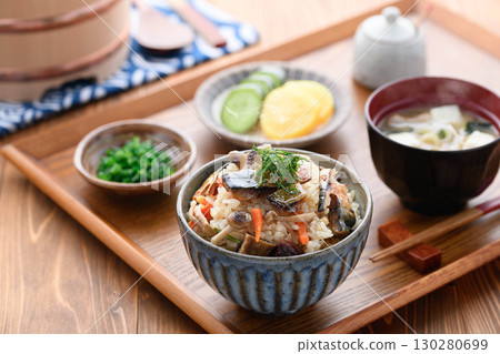 A steaming Japanese breakfast, lunch, and dinner set meal featuring a luxurious dish of mackerel jerky. A steaming Japanese breakfast, lunch, and dinner set meal featuring a luxurious dish of mackerel jerky. 130280699