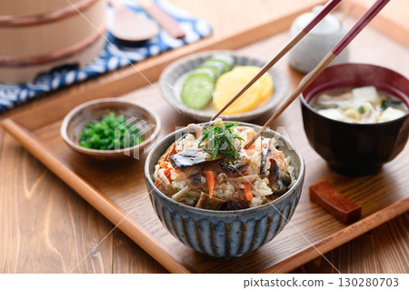 A steaming Japanese breakfast, lunch, and dinner set meal featuring a luxurious dish of mackerel jerky. 130280703