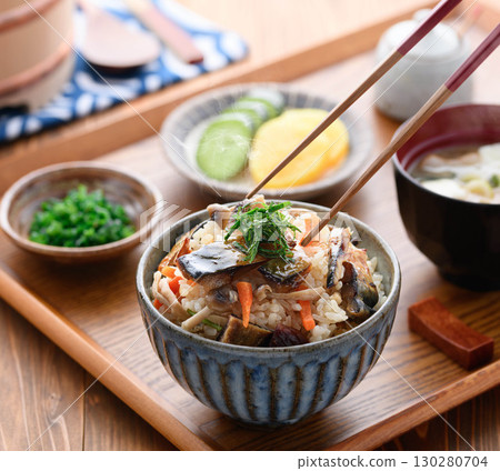 A steaming Japanese breakfast, lunch, and dinner set meal featuring a luxurious dish of mackerel jerky. 130280704