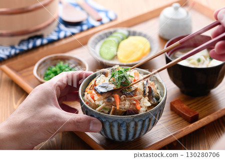 A steaming Japanese breakfast, lunch, and dinner set meal featuring a luxurious dish of mackerel jerky. A steaming Japanese breakfast, lunch, and dinner set meal featuring a luxurious dish of mackerel jerky. 130280706