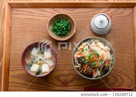 A steaming Japanese breakfast, lunch, and dinner set meal featuring a luxurious dish of mackerel jerky. 130280712