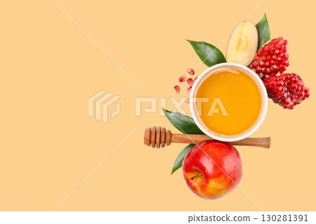 Arrangement of honey bowl with apples and pomegranates nearby Arrangement of honey bowl with apples and pomegranates nearby 130281391