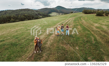 Aerial view of multigenerational family on hiking trip in nature. 130282329