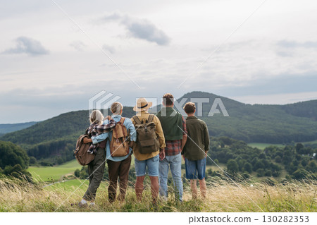 Multigenerational family on hiking trip in nature. Multigenerational family on hiking trip in nature. 130282353