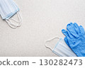 Medical face masks and single use gloves laying on table flat lay view 130282473