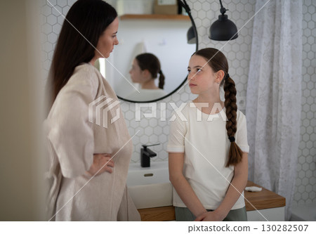 Mother scolding her teenage daughter. 130282507