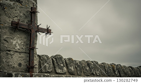 Cross on stone wall symbolizes human suffering, a deep history of suffering Cross on stone wall symbolizes human suffering, a deep history of suffering 130282749