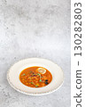 Traditional Georgian bean soup Lobio with herbs in ceramic plate 130282803