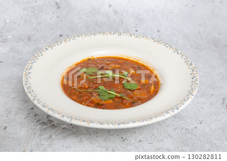 Traditional Georgian bean soup Lobio with herbs in ceramic plate Traditional Georgian bean soup Lobio with herbs in ceramic plate 130282811