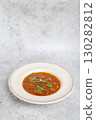 Traditional Georgian bean soup Lobio with herbs in ceramic plate 130282812