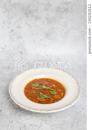 Traditional Georgian bean soup Lobio with herbs in ceramic plate Traditional Georgian bean soup Lobio with herbs in ceramic plate 130282812