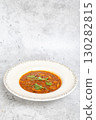 Traditional Georgian bean soup Lobio with herbs in ceramic plate 130282815