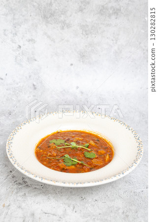 Traditional Georgian bean soup Lobio with herbs in ceramic plate Traditional Georgian bean soup Lobio with herbs in ceramic plate 130282815