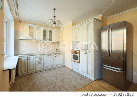 This modern kitchen interior features stunning stainless steel appliances and elegant design This modern kitchen interior features stunning stainless steel appliances and elegant design 130282838
