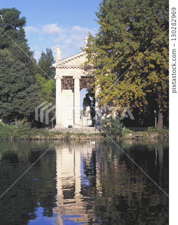 Old townscape of Rome Temple of Asclepius on the bank of a pond 130282969
