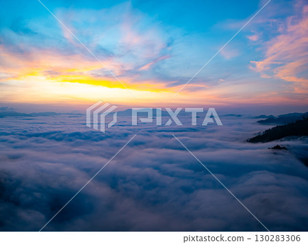 Amazing Sunrise over mountains hills covered with mist, Aerial view landscape drone shot beautiful sky colorful light nature background Amazing Sunrise over mountains hills covered with mist, Aerial view landscape drone shot beautiful sky colorful light nature background 130283306