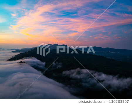 Amazing Sunrise over mountains hills covered with mist, Aerial view landscape drone shot beautiful sky colorful light nature background 130283307