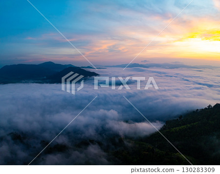Amazing Sunrise over mountains hills covered with mist, Aerial view landscape drone shot beautiful sky colorful light nature background 130283309